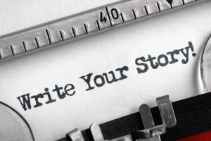Schreibmaschine mit Text: "Write Your Story!" die symbolisch für das Narrativ im Marketing stehen soll